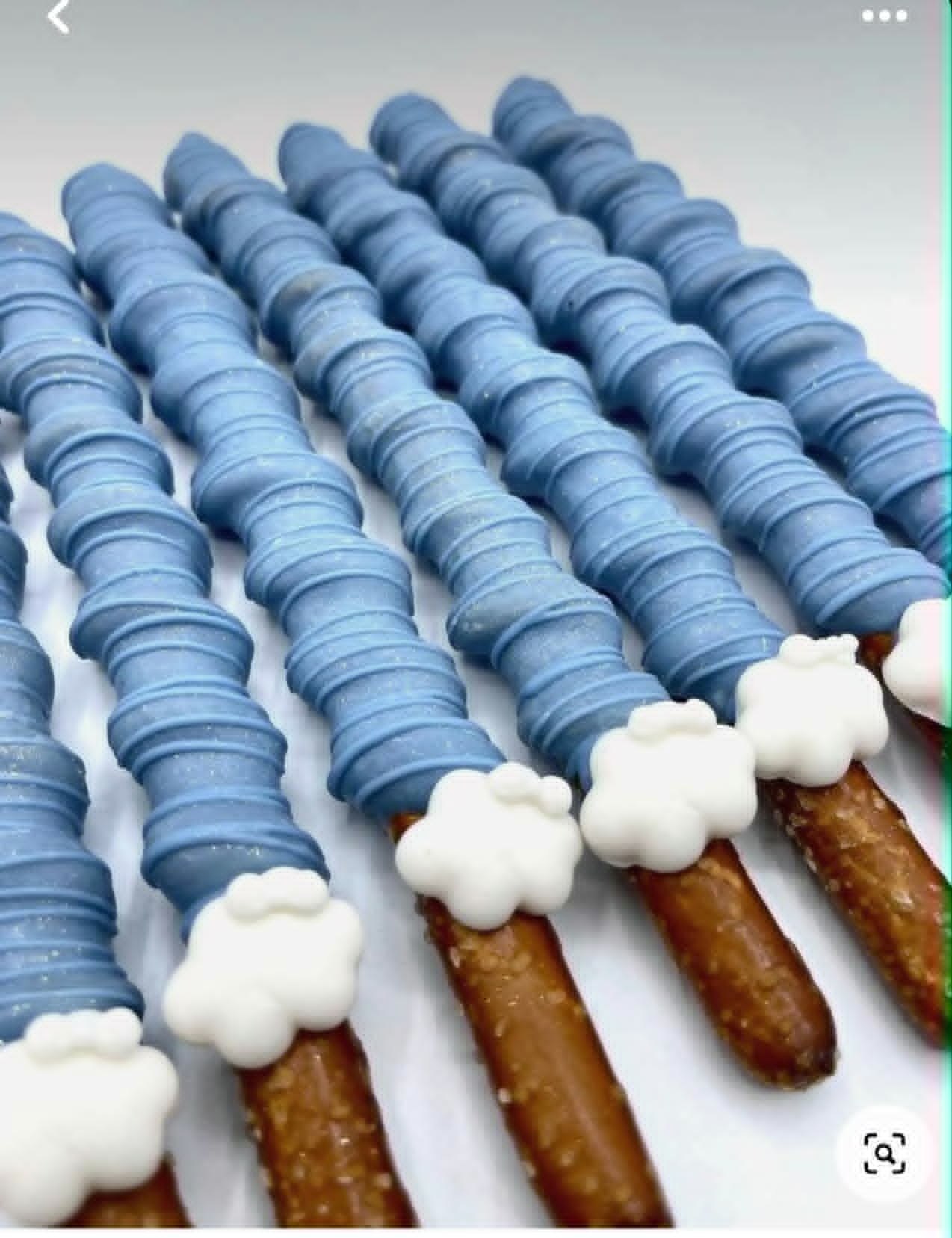 Blue dipped pretzel favors arranged for an event